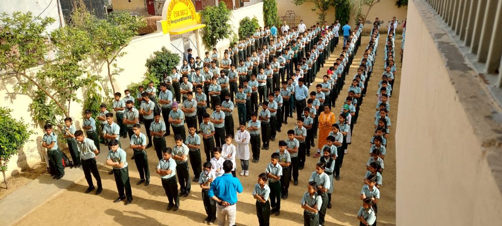 Students gathered in school courtyard activity